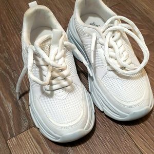 All white platform sneakers